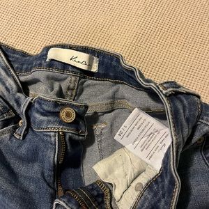 2 pairs of Kancan jeans.